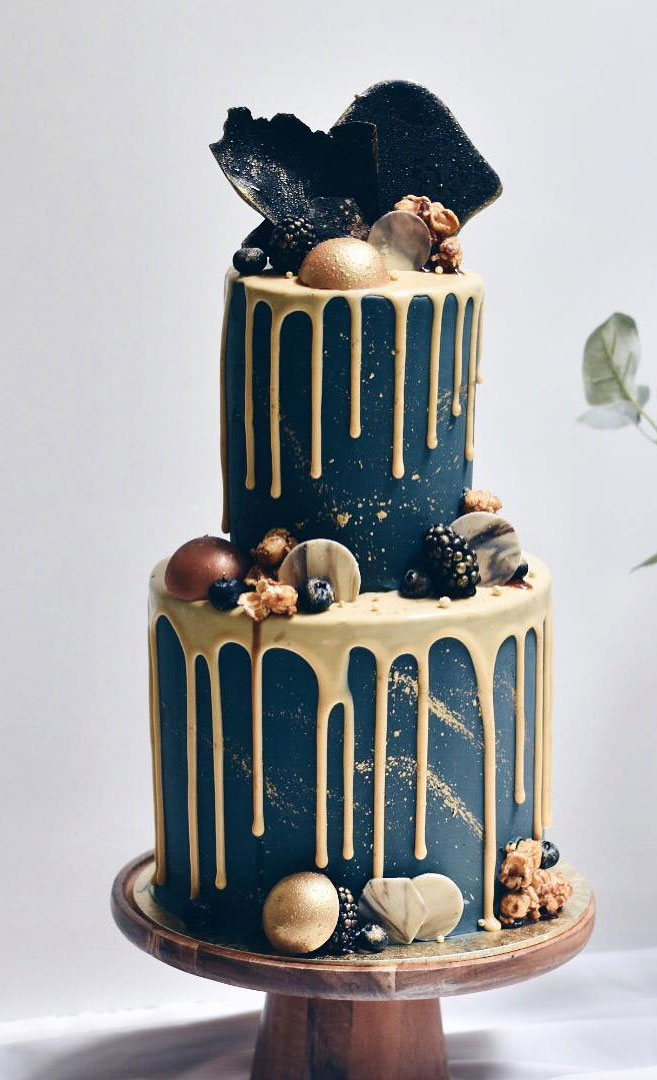 Gold Drip Wedding Cake With Chocolate And Sweet Topped