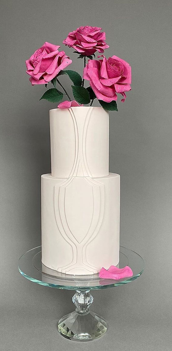 22 Clean and Contemporary Wedding Cakes : Pink bloom on matte white cake