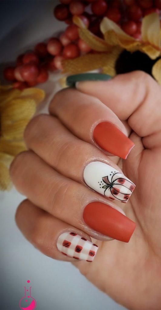 40 Beautiful Nail Design Ideas To Wear In Fall plaid and pumpkin nails