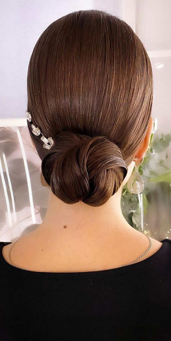 Updo Hairstyles For Your Stylish Looks In 2021 : Sleek knot low bun