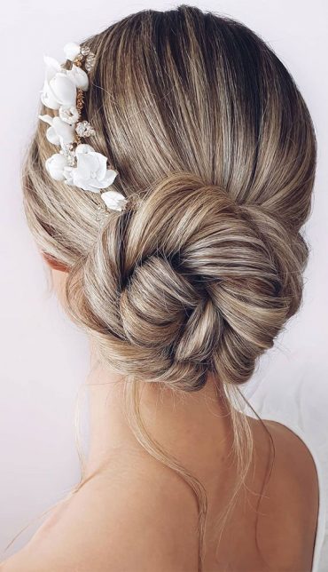 70 Latest Updo Hairstyles For Your Trendy Looks In 2021 Bridal Bun With White Accessories 9739