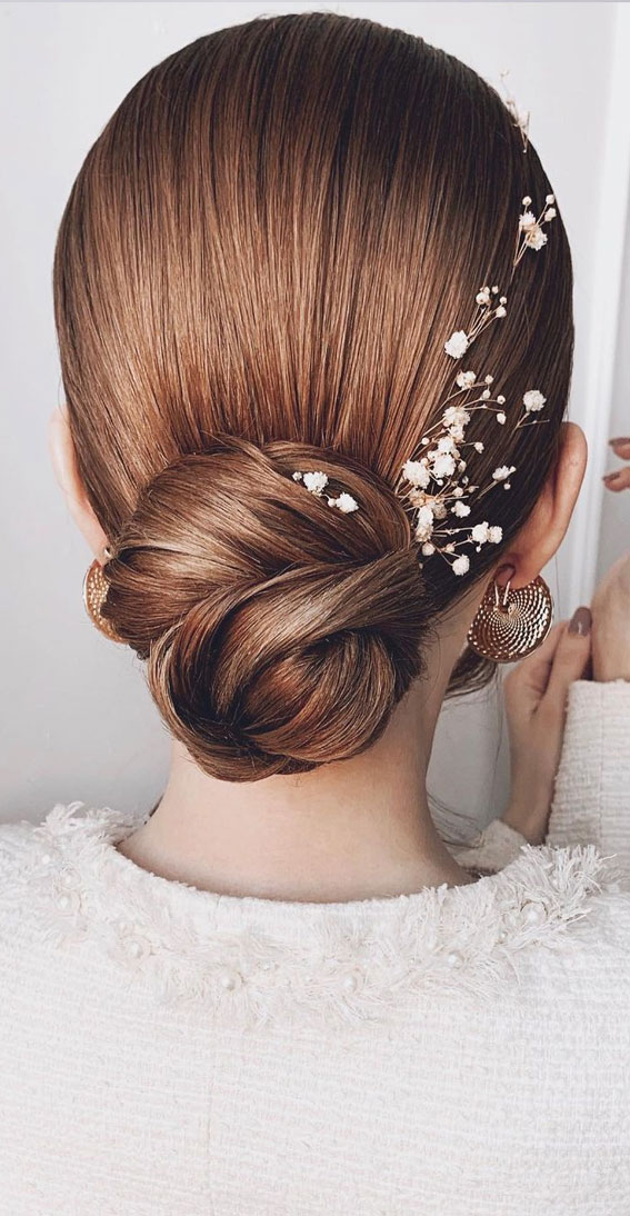 Updo Hairstyles For Your Stylish Looks In 2021 Sleek Low Updo With Small White Flower 1297