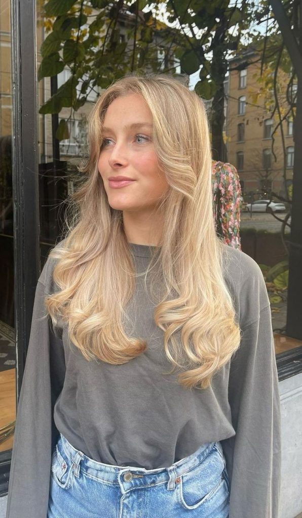 43 Curtain Bangs That Re So Trendy In 2022 Blonde Long Hair With Curl   Curtain Bangs 2022 20 596x1024 