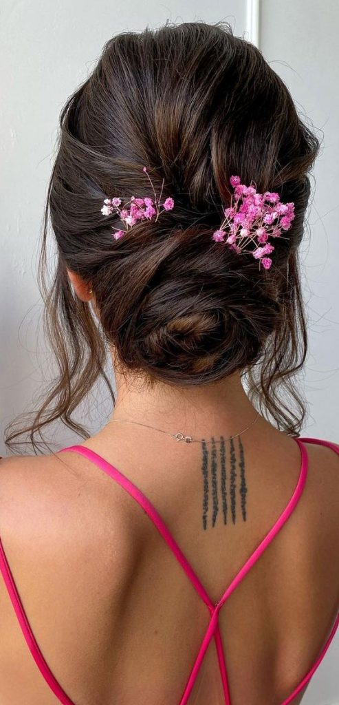 50 Best Updo Hairstyles For Trendy Looks In 2022 Messy Rosebud Bun With Pink Flowers 4153