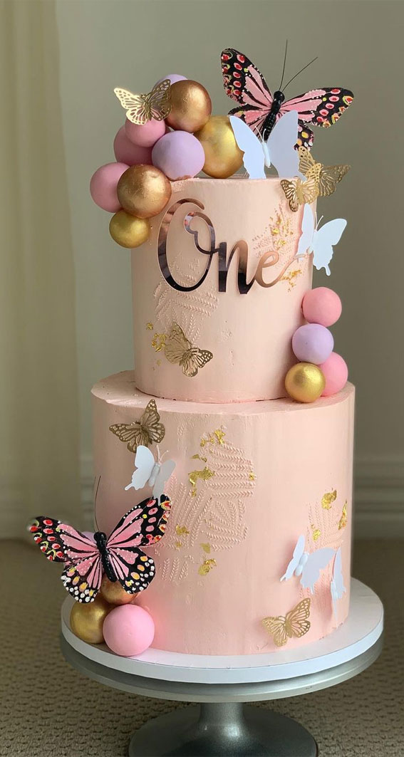 25-baby-girl-first-birthday-cake-ideas-two-tiered-pink-cake-adorned