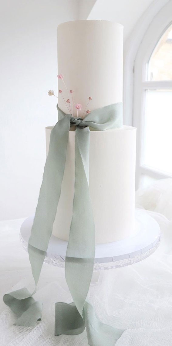 40 Cute Minimalist Cake Designs for Any Celebration : Two-Tiered Wedding Cake with Blue Ribbon