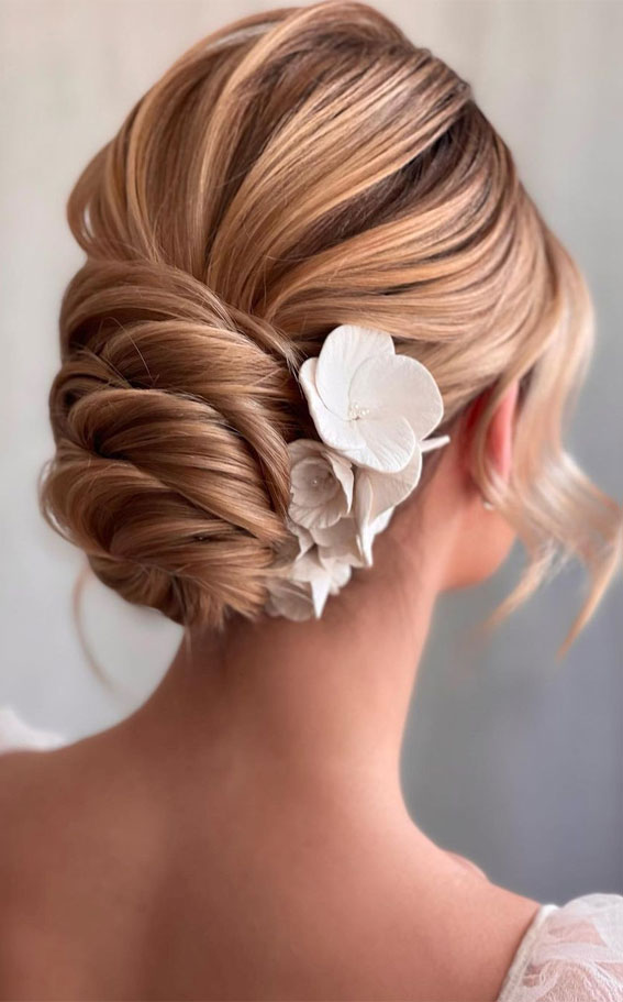 50 Amazing Ways To Style An Updo in 2022 : Twisted Low Bun with White Flower Accessories