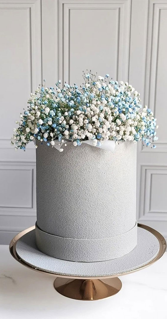 70 Cake Ideas for Birthday & Any Celebration : Grey Textured Cake Topped with Blue and White Flowers
