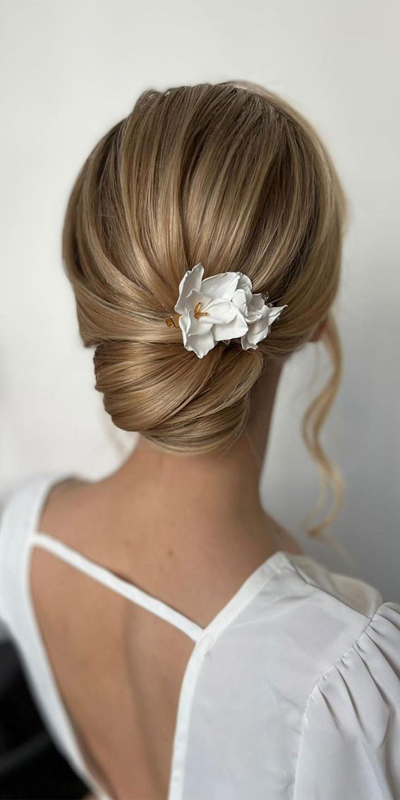 53 Best Wedding Hairstyles for 2023 Brides : Simple Low Bun with