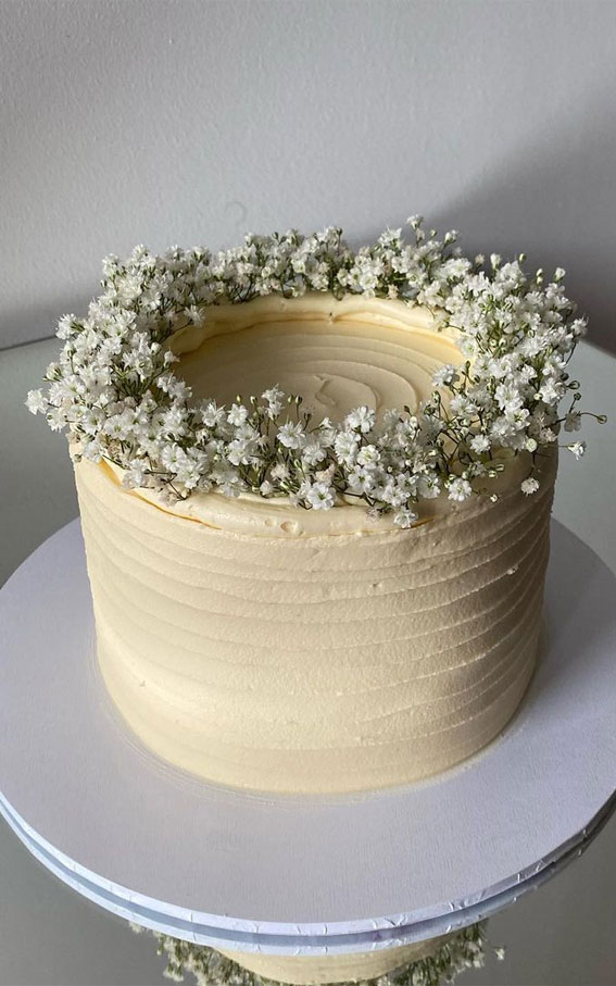 40+ Cute Simple Birthday Cake Ideas : White Swirl Cake Topped with Baby’s Breath