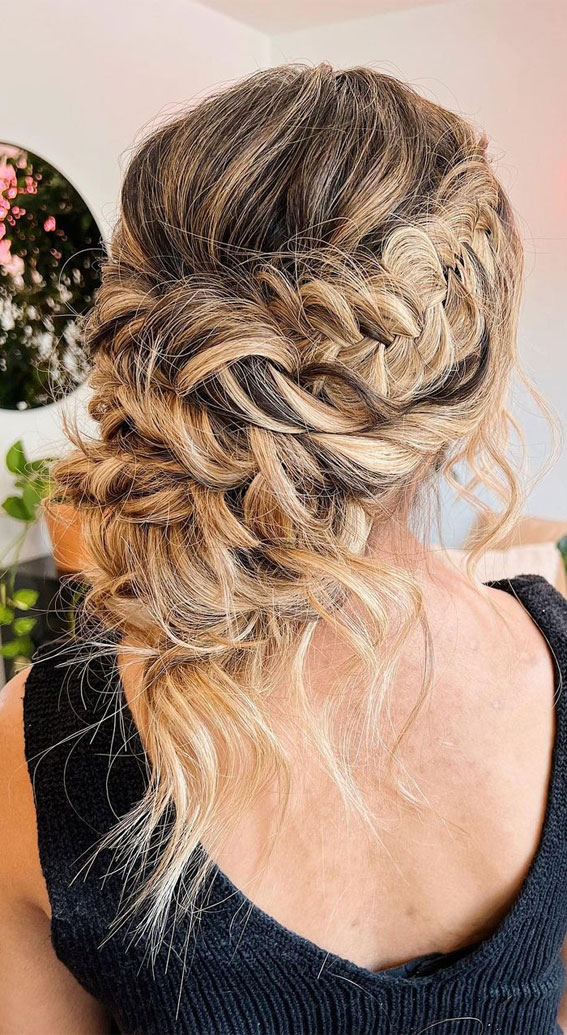 50+ Updo Hairstyles That’re So Stylish : Braided Loose Low Bun with Texture