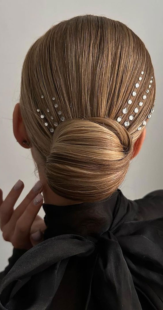 50+ Updo Hairstyles That’re So Stylish : Sleek Low Bun with Rhinestones