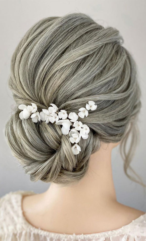 35 Enchanting Hairstyles for a Fairytale Wedding : Ethereal Updo with White Floral Hair Accessories