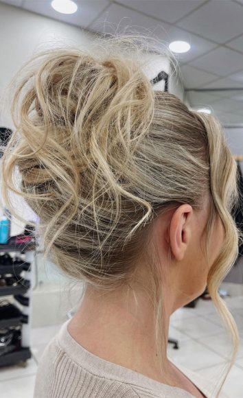 Elevate Your Look with Chic Hairstyling Ideas : Messy High Bun Upstyle