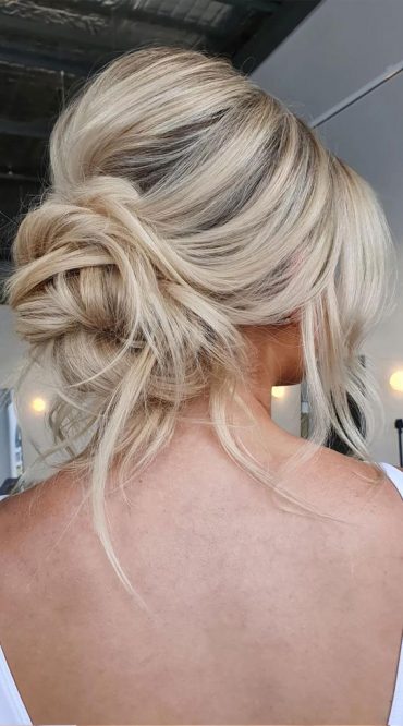 Elevate Your Look With Chic Hairstyling Ideas : Undone Know Low Bun ...