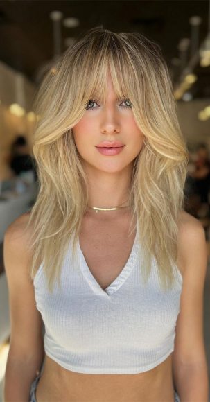 Enchanting Hair Colour Trends To Illuminate 2024 : Butter Blonde Long Shag