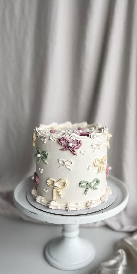 50 Birthday Cake Ideas to Delight and Impress : White Cake with Muted Pastel Bows