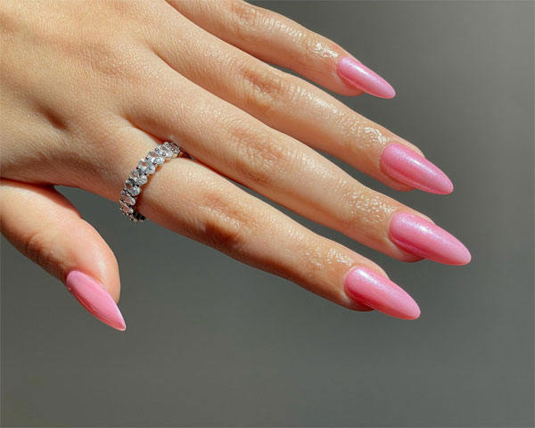 Bright Pink Glazed Trendy Almond Nails with Understated Elegance