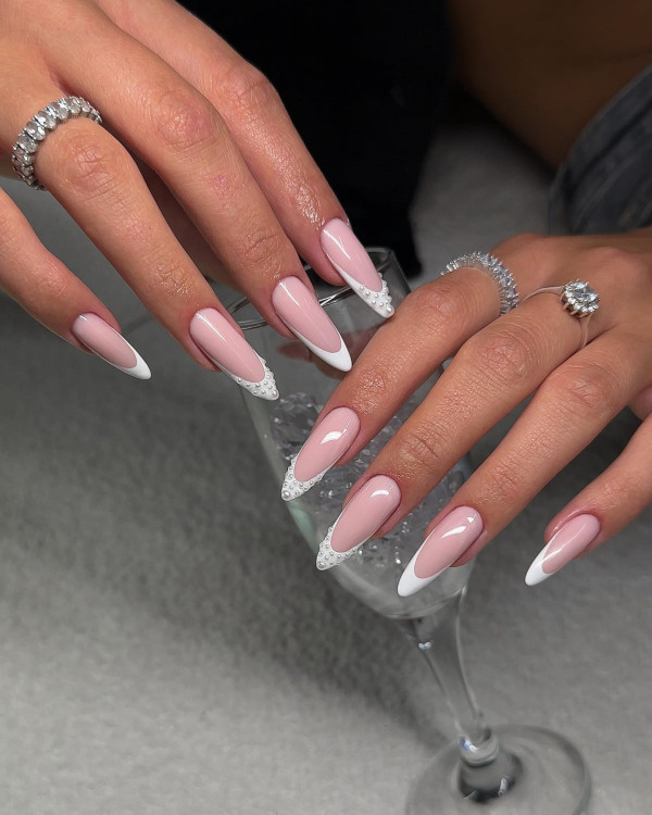 trendy almond nails, French tip trendy almond nails, pearl accented almond nails, elegant trendy almond nails