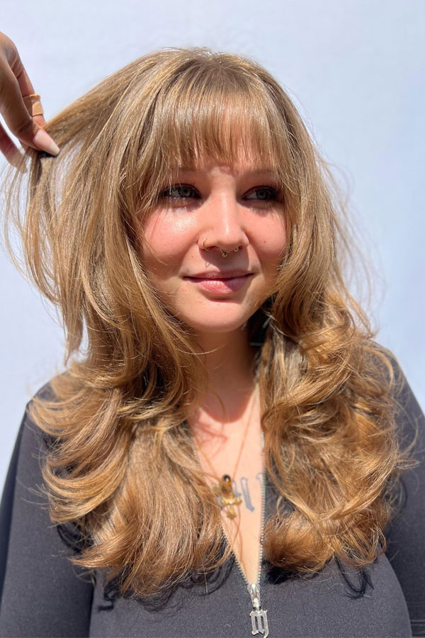 60 Cute Layered Hairstyles For Long Hair : Blonde Bouncy Layered with Textured Bangs