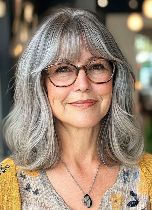 20 Medium-Length Haircuts for Women Over 60 with Glasses : Soft Silver Long Bob