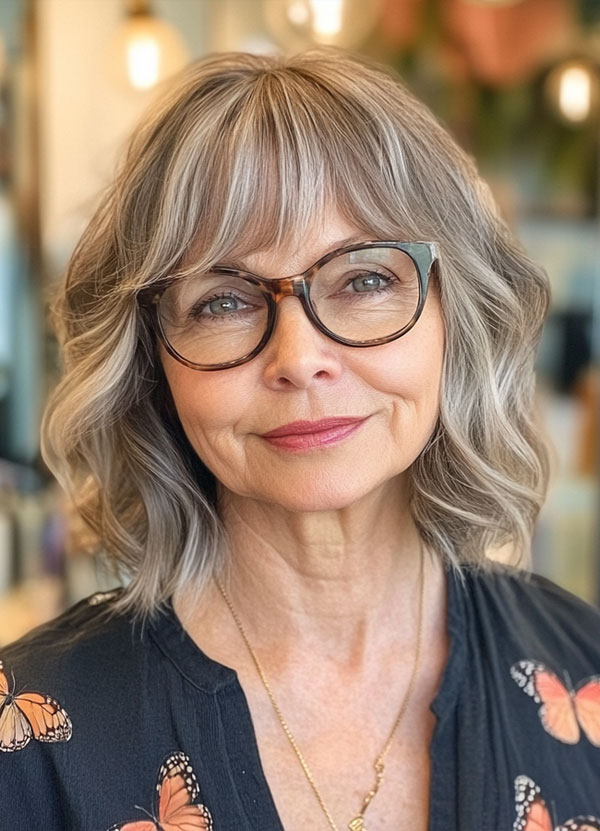 20 Medium-Length Haircuts for Women Over 60 with Glasses : Soft Silver Waves