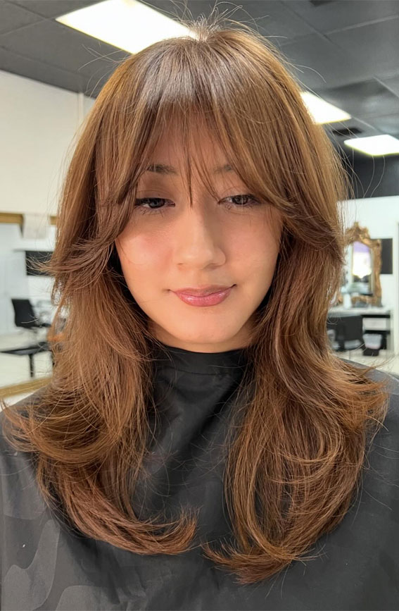 Caramel-Brown Layers with Wispy Bangs, , shoulder length layered haircut, Trending Medium Layered Haircuts, medium length layered haircut, medium length layered hairstyle