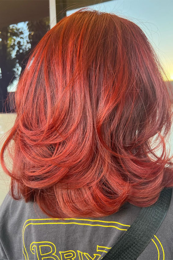 Fiery Red Layers with Voluminous Bounce, shoulder length layered haircut, Trending Medium Layered Haircuts, medium length layered haircut, medium length layered hairstyle