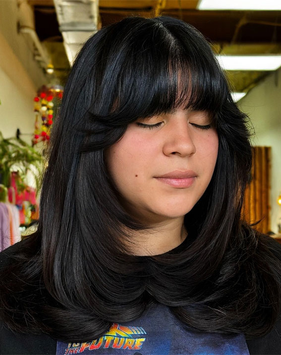 Jet-Black Volume Layers with Full Fringe, shoulder length layered haircut, Trending Medium Layered Haircuts, medium length layered haircut, medium length layered hairstyle