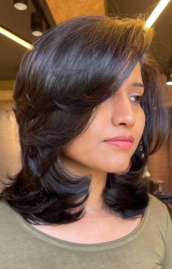 35 Trending Medium Layered Haircuts : Layered Blowout with Side-Swept Bangs