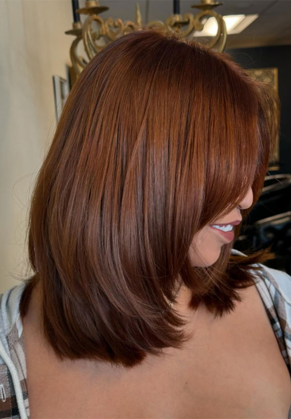 35 Trending Medium Layered Haircuts : Warm Chestnut Layers with Side-Swept Bangs