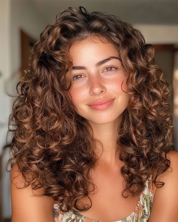 37 Shoulder-Length Curly Hairstyles with Layers : Natural Chestnut Curls with Flowing Layers