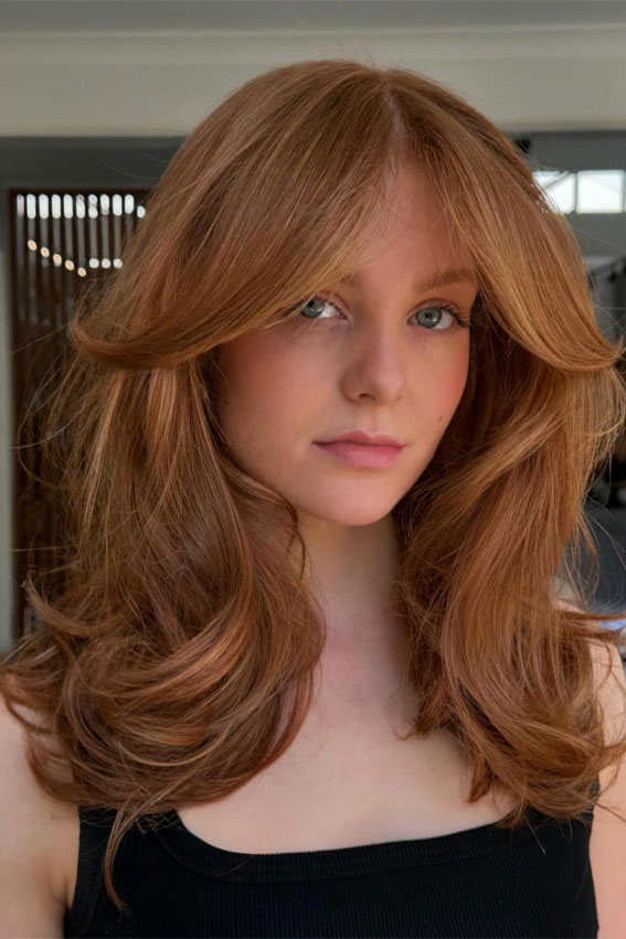 45 Winter Hair Colour Inspiration You Can’t Miss : Golden Auburn Layers with Curtain Bangs