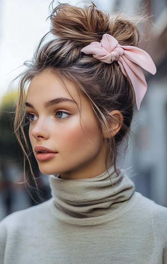 Messy Top Knot with a Pink Bow, easy updo hairstyle, messy bun, Effortless hairstyles for medium hair, Effortless hairstyles for long hair, Easy hairstyles to do yourself, Work hairstyles for medium hair, Work hairstyles for long hair