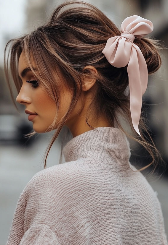 32 Effortless Hairstyles That Look Chic in Minutes : Low Bun with a Statement Bow