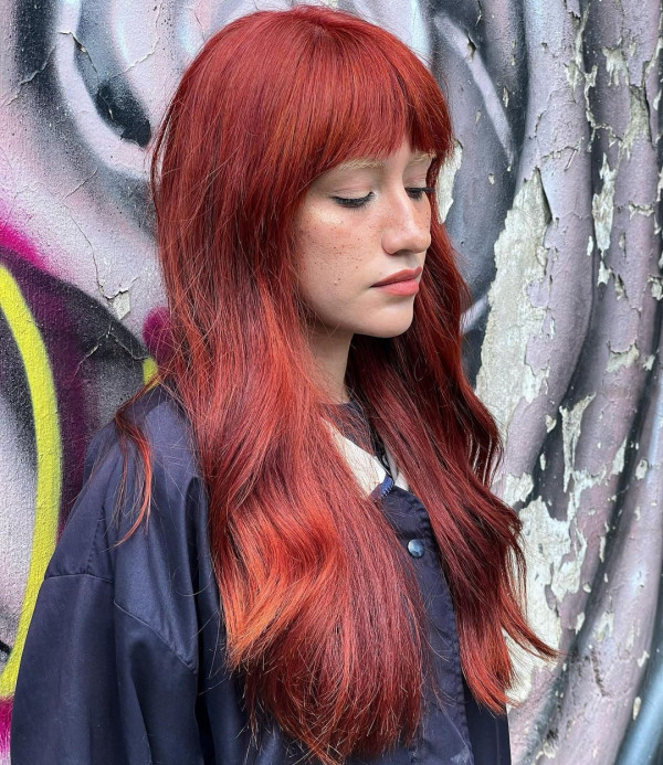 41 Red Hair Colours You’ll Adore: Fiery Copper Waves with Blunt Fringe