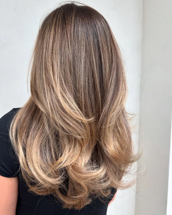 Golden Ash Blonde Long Hair with Feathered Layers