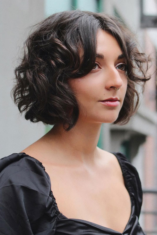 23 French Hairstyles for Effortless Chic Style : Soft Curly Bob with a Centre Parting