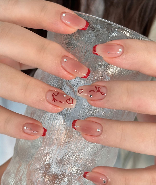 36 Cute Valentine’s Day Nails : Red-Tipped Nails with Bow & Heart Details