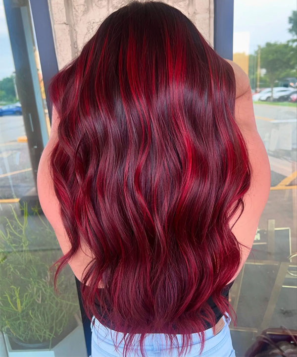 41 Red Hair Colours You’ll Adore: Crimson Balayage Loose Waves