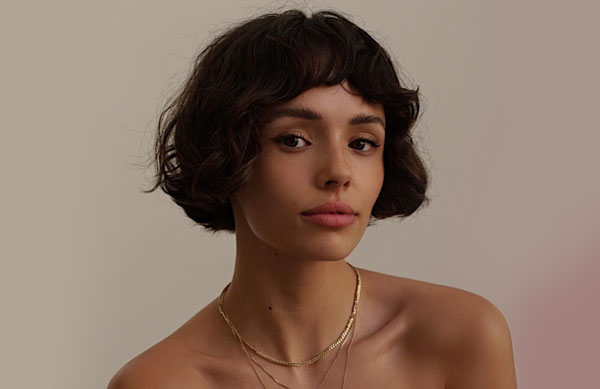 23 French Hairstyles for Effortless Chic Style : Short Curly Bob with Micro Fringe