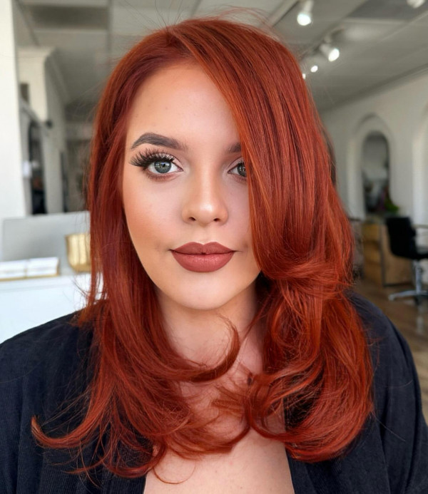 41 Red Hair Colours You’ll Adore: Vibrant Auburn Layers with Curtain Bangs