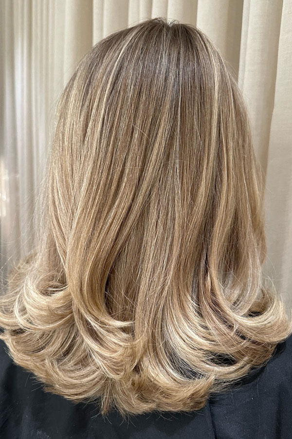 Medium-Length Champagne Blonde with Flipped Ends