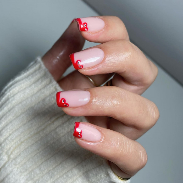 Red French Tips with Comme des Garçons Accent, Red Comme des Garçons-Inspired French Tip Nails , Comme des Garçons Tip Nude Nails, minimalist Comme des Garcons nails