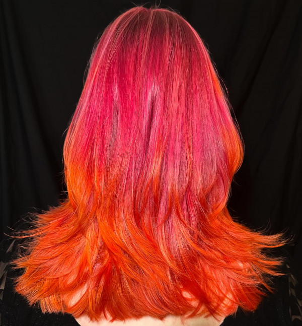 40 Shades of Hair Colours That Make a Statement : Layered French Haircut with a Red to Orange Vivid Melt