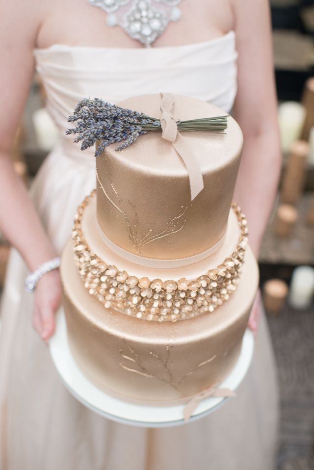 gold wedding cake topped laveder