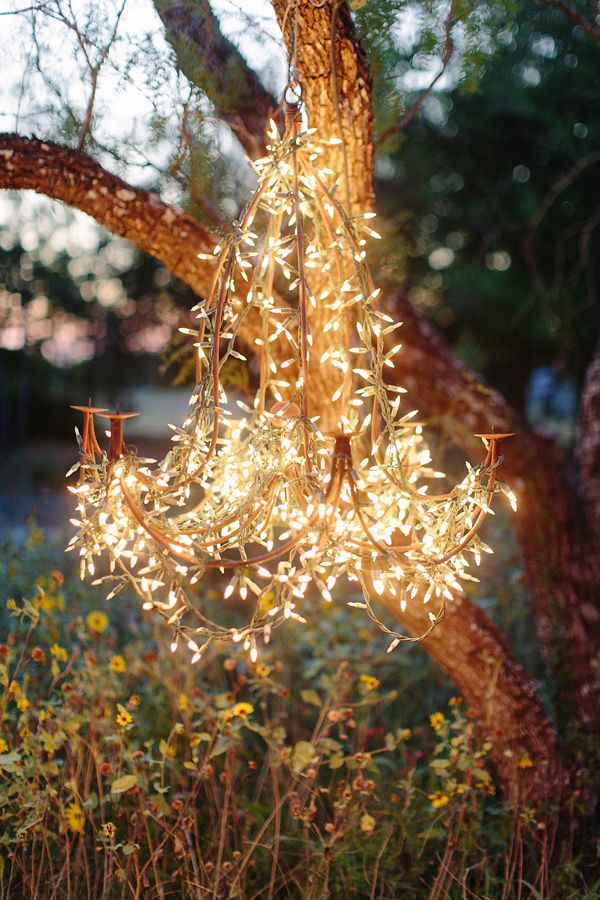 whimsical wedding lighting idea - string lights wrapped around a wire DIY chandelier