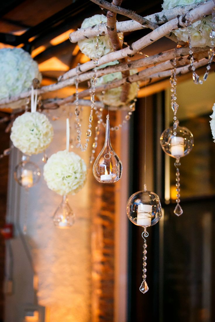 hanging floral poms and candle votives