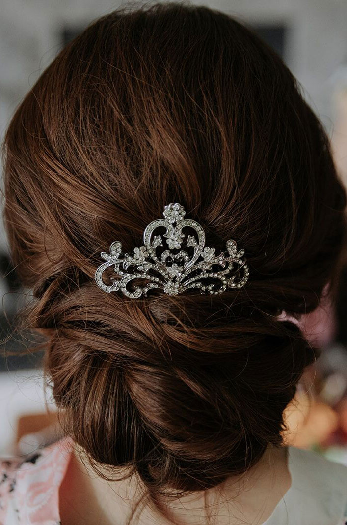 Classic low updo bridal hairstyle -Gorgeous two tier wedding cake adorned with blush and burgundy flowers -Intimate Wedding With A Touch Of A Moody Palette For A Destination Wedding 