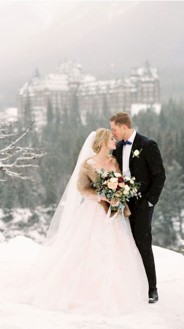 Dreamy winter wedding photos with snow background